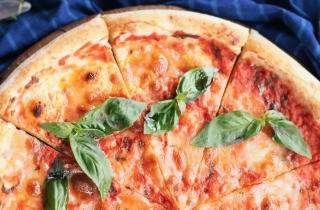 Image of a Margherita pizza on a wooden board