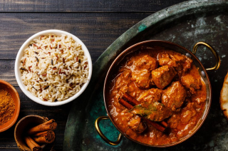 Curry and naan bread on a plate