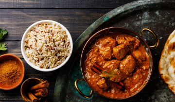 Curry and naan bread on a plate